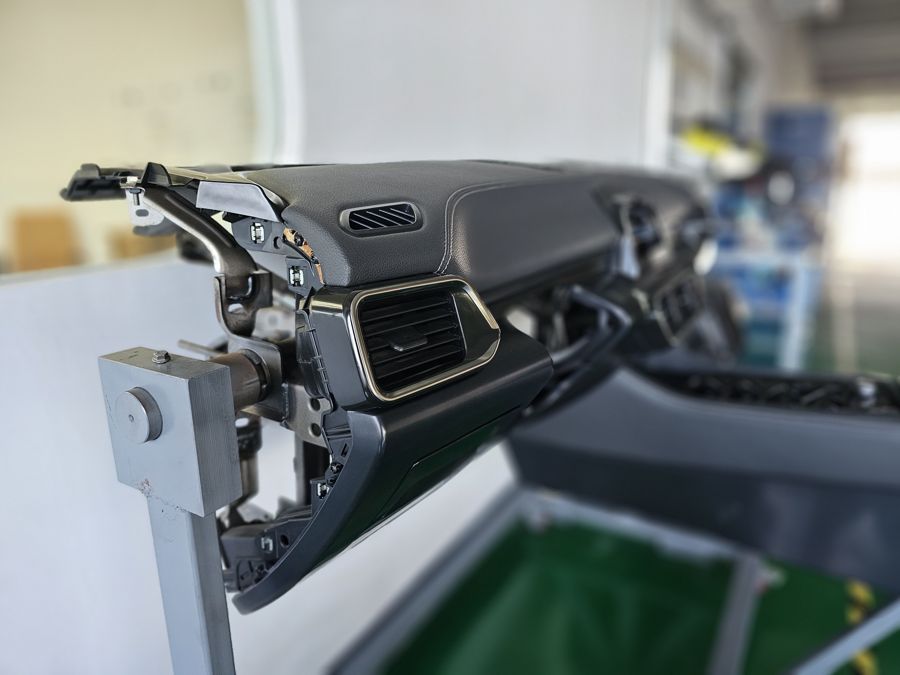 Automotive dashboard and air vent assembly on inspection fixture
