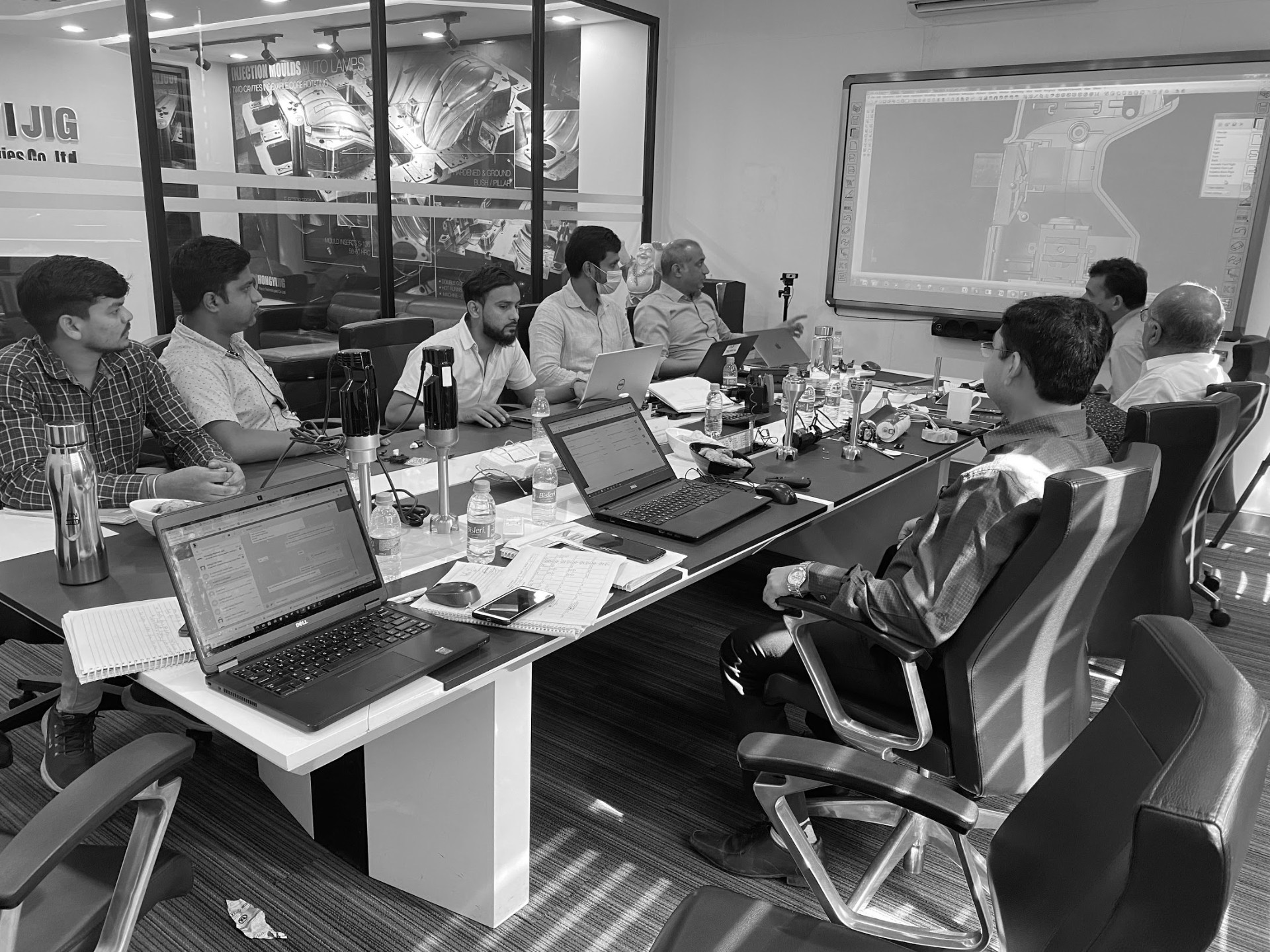 Team discussing critical project issues in boardroom